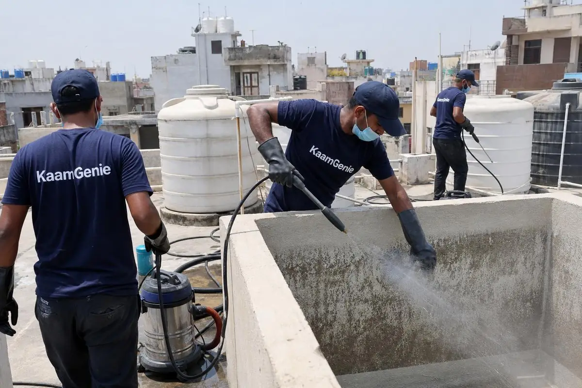 KaamGenie crew cleaning a overhead (rooftop) tank in Adarsh Nagar, Delhi