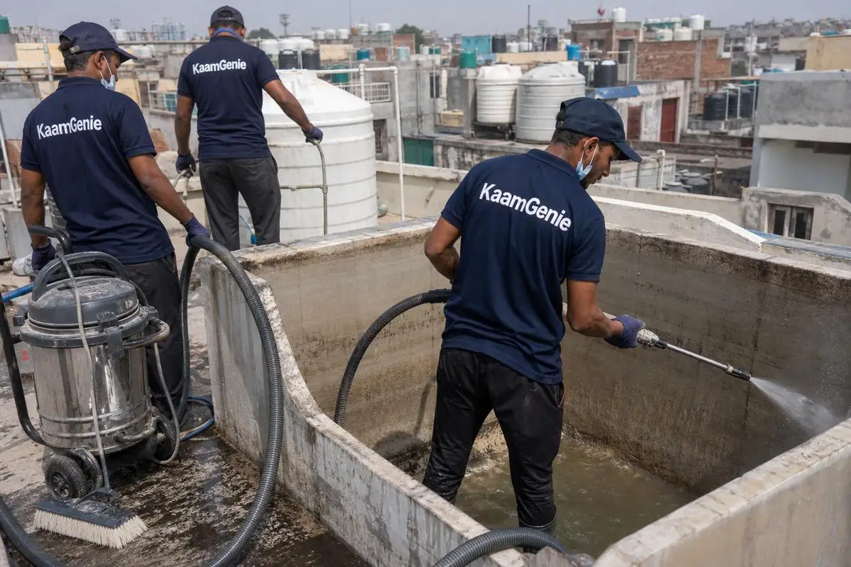 KaamGenie crew cleaning a overhead (rooftop) tank in Babarpur, Delhi