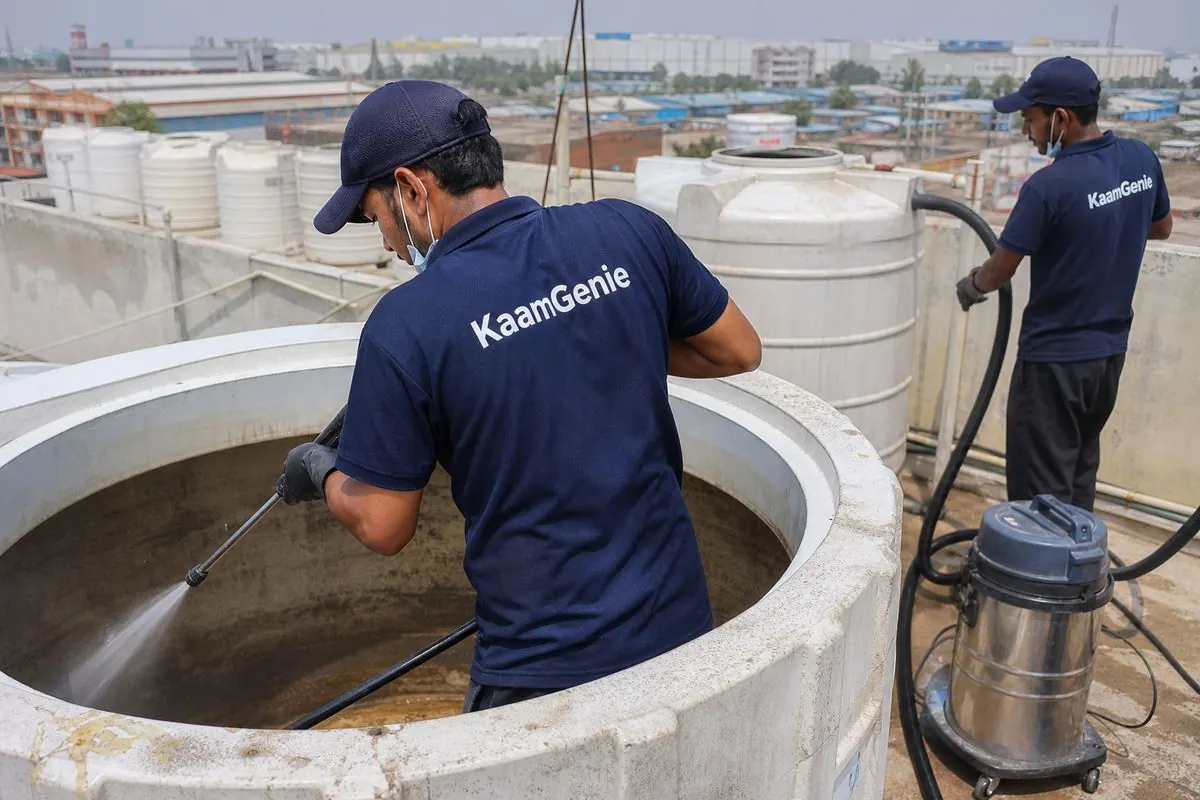 KaamGenie crew cleaning a overhead (rooftop) tank in Bawana, Delhi