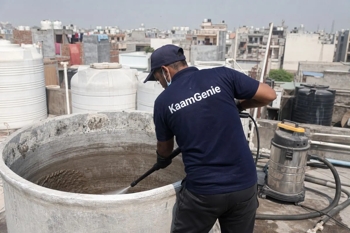 KaamGenie crew cleaning a overhead (rooftop) tank in Burari, Delhi