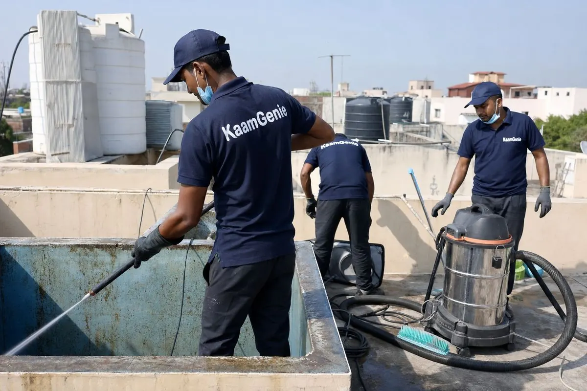 KaamGenie crew cleaning a overhead (rooftop) tank in Delhi Cantt, Delhi