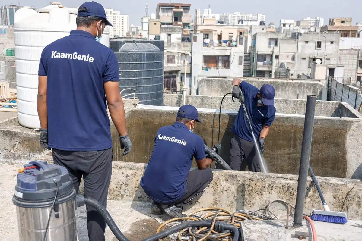 KaamGenie crew cleaning a overhead (rooftop) tank in Dwarka Sector 1, Delhi