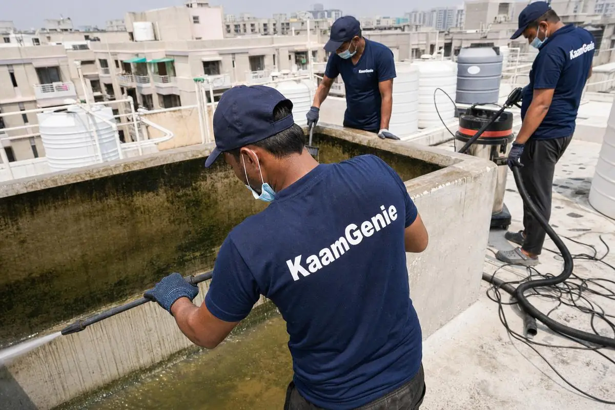 KaamGenie crew cleaning a overhead (rooftop) tank in Dwarka Sector 11, Delhi