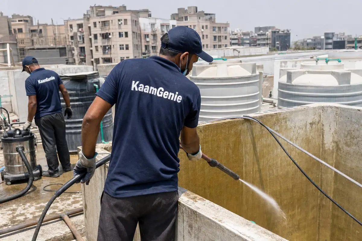 KaamGenie crew cleaning a overhead (rooftop) tank in Dwarka Sector 12, Delhi