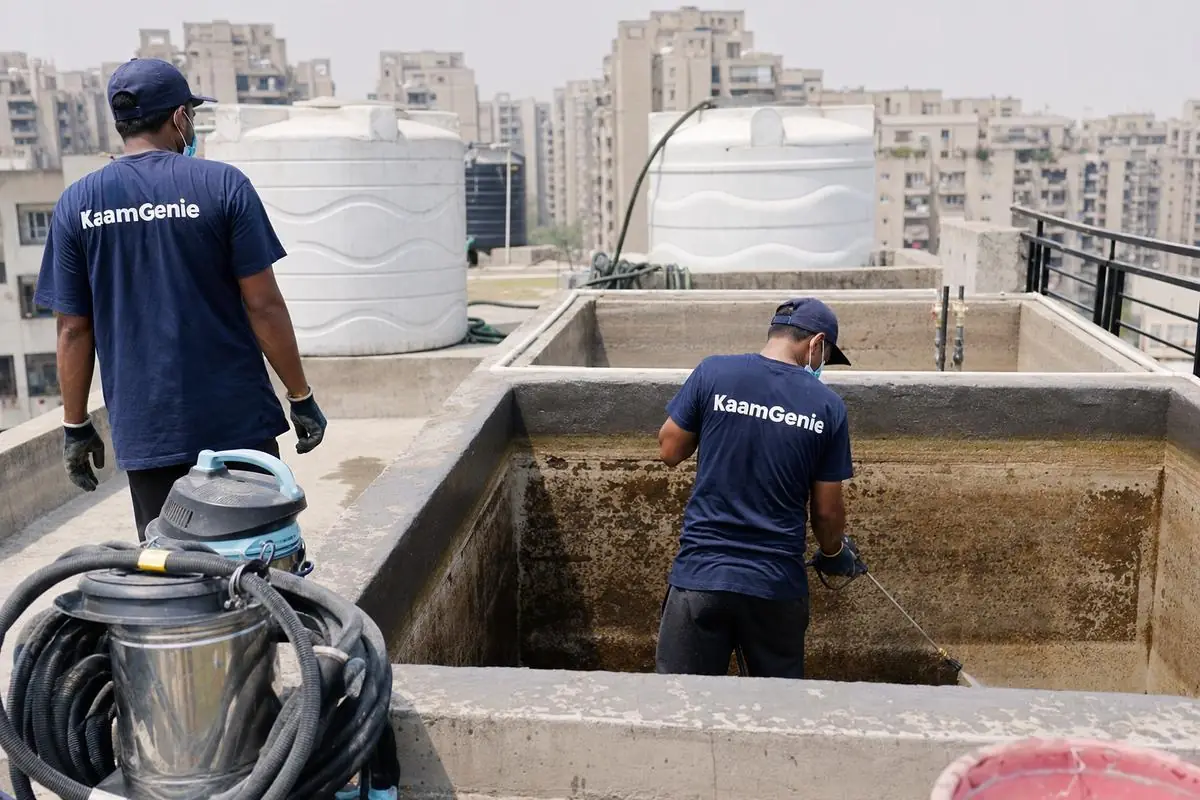 KaamGenie crew cleaning a overhead (rooftop) tank in Dwarka Sector 13, Delhi