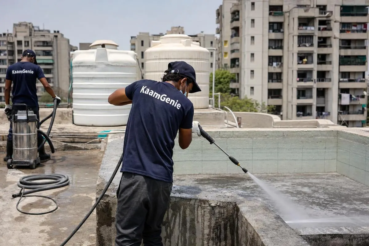 KaamGenie crew cleaning a overhead (rooftop) tank in Dwarka Sector 16, Delhi