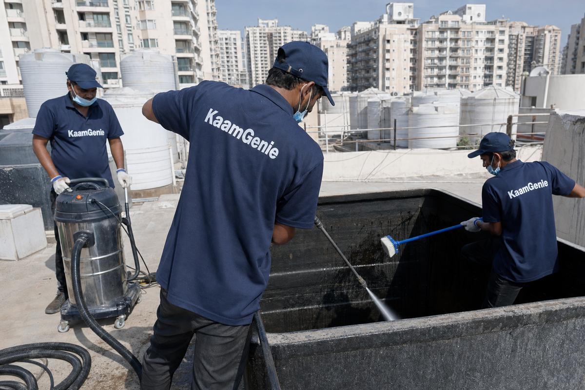 KaamGenie crew cleaning a overhead (rooftop) tank in Dwarka Sector 18, Delhi