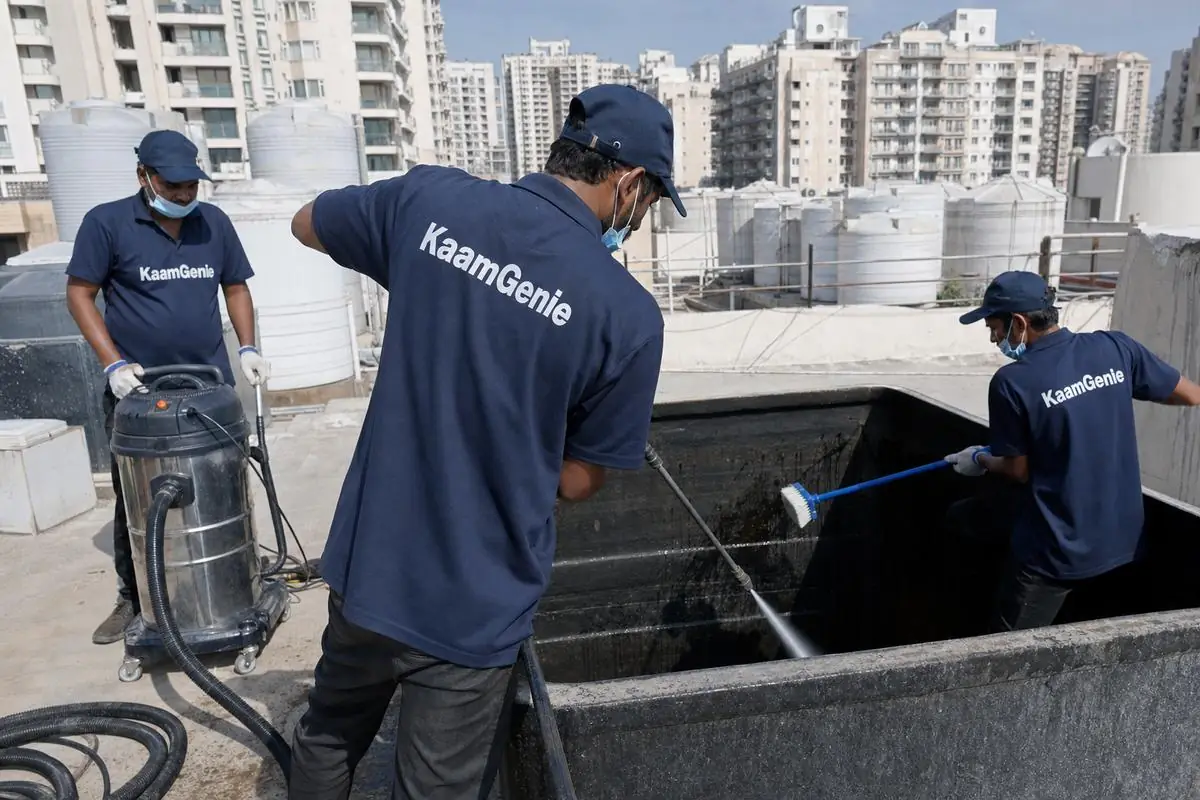 KaamGenie crew cleaning a overhead (rooftop) tank in Dwarka Sector 18, Delhi