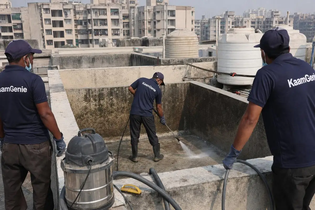 KaamGenie crew cleaning a overhead (rooftop) tank in Dwarka Sector 19, Delhi