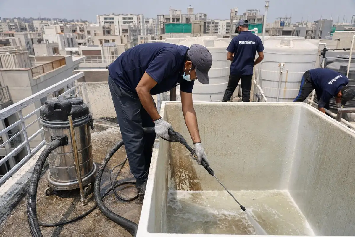 KaamGenie crew cleaning a overhead (rooftop) tank in Dwarka Sector 20, Delhi