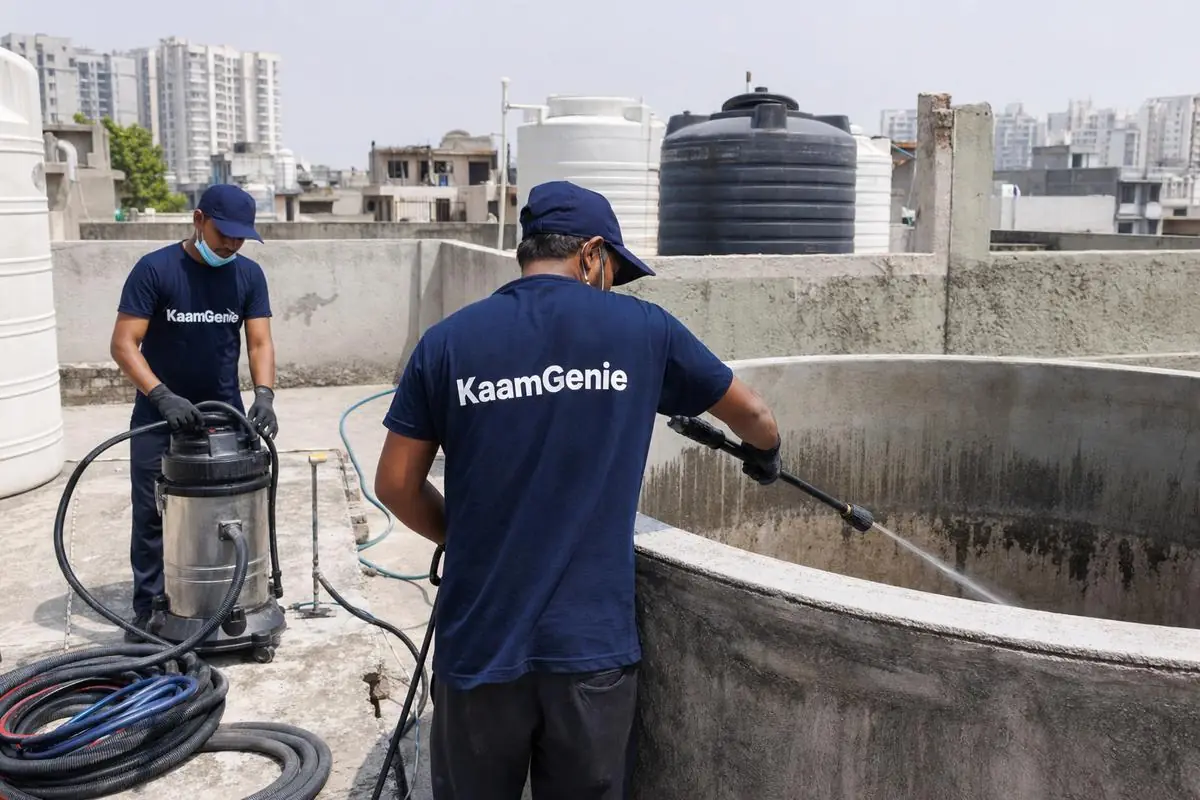 KaamGenie crew cleaning a overhead (rooftop) tank in Dwarka Sector 25, Delhi
