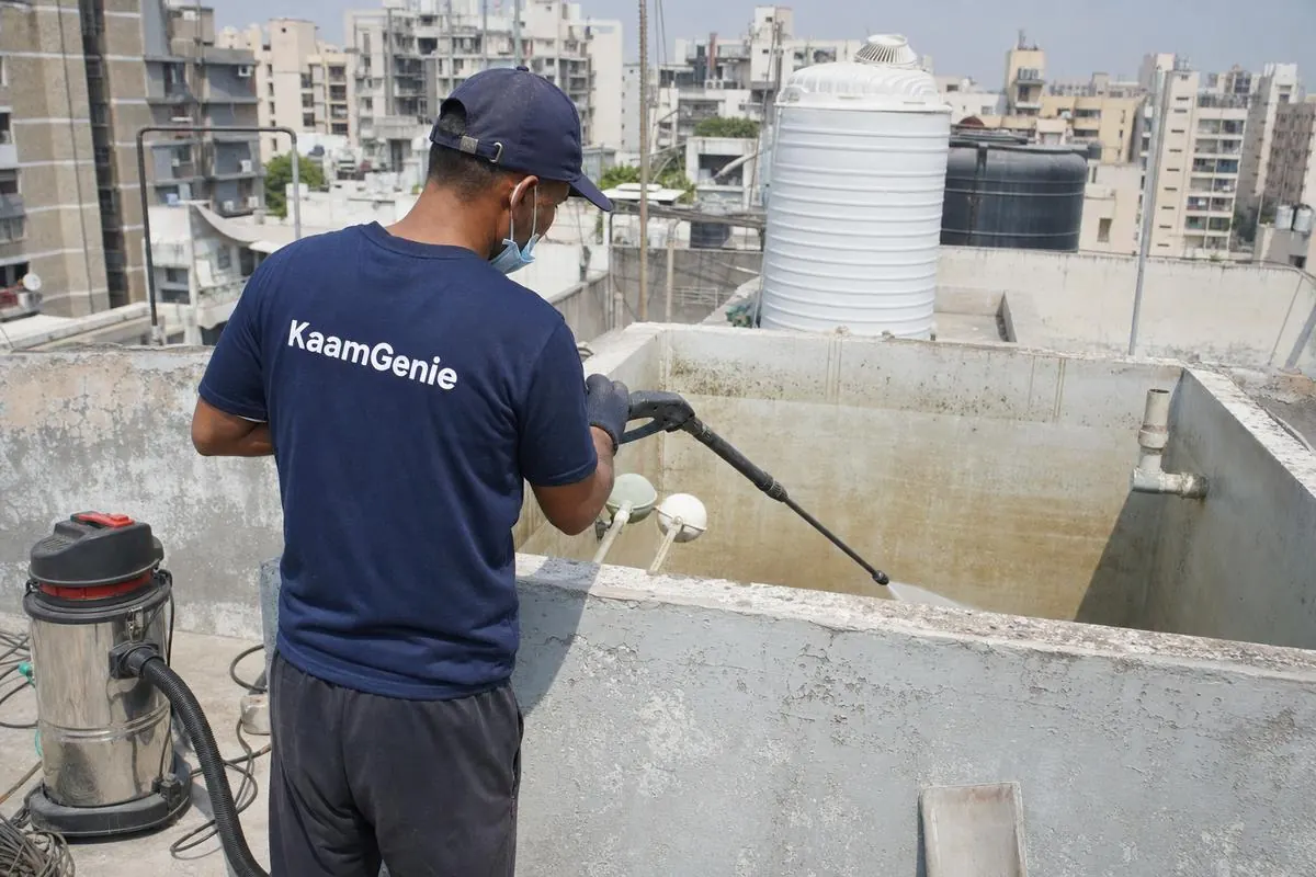 KaamGenie crew cleaning a overhead (rooftop) tank in Dwarka Sector 29, Delhi