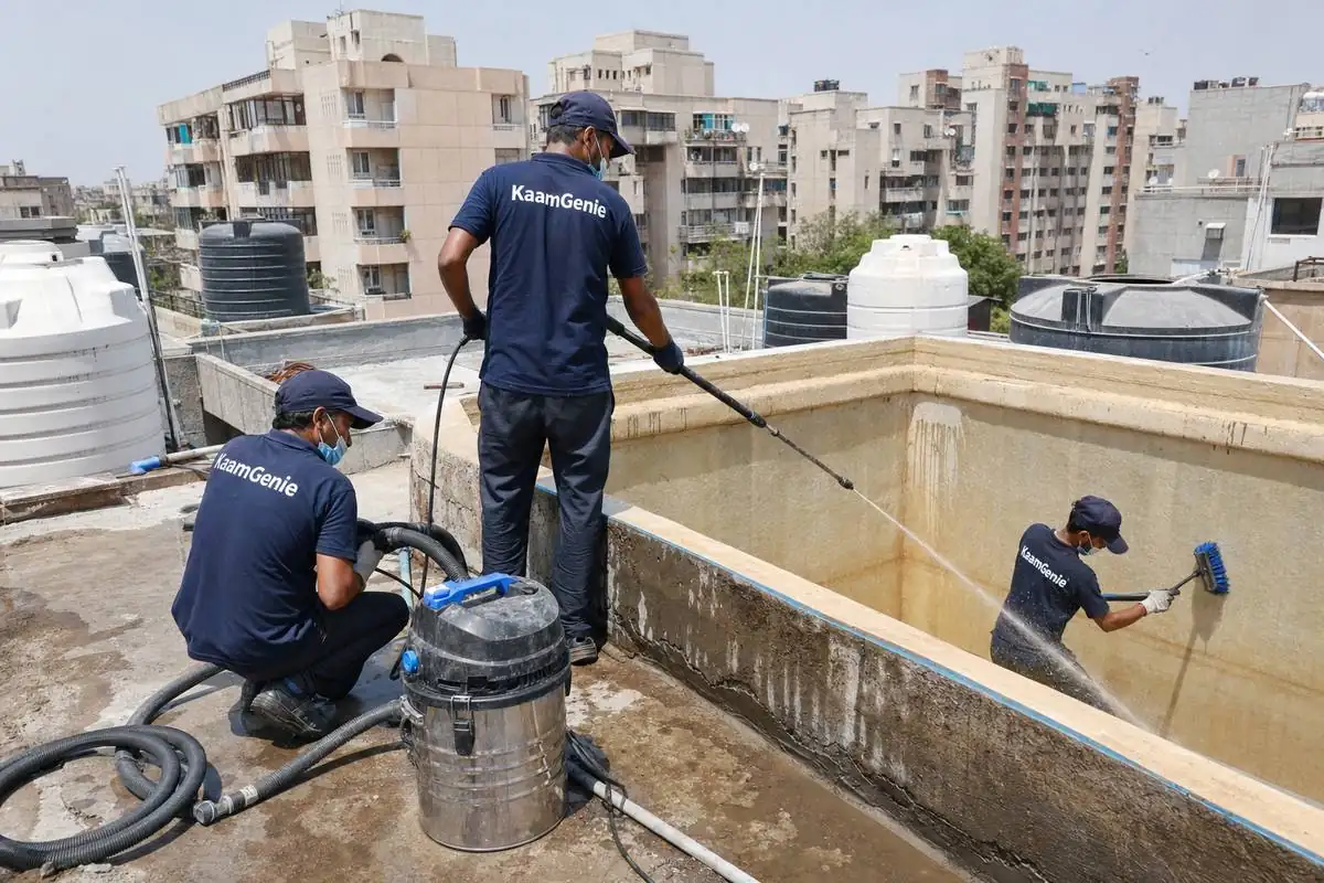 KaamGenie crew cleaning a overhead (rooftop) tank in Dwarka Sector 6, Delhi