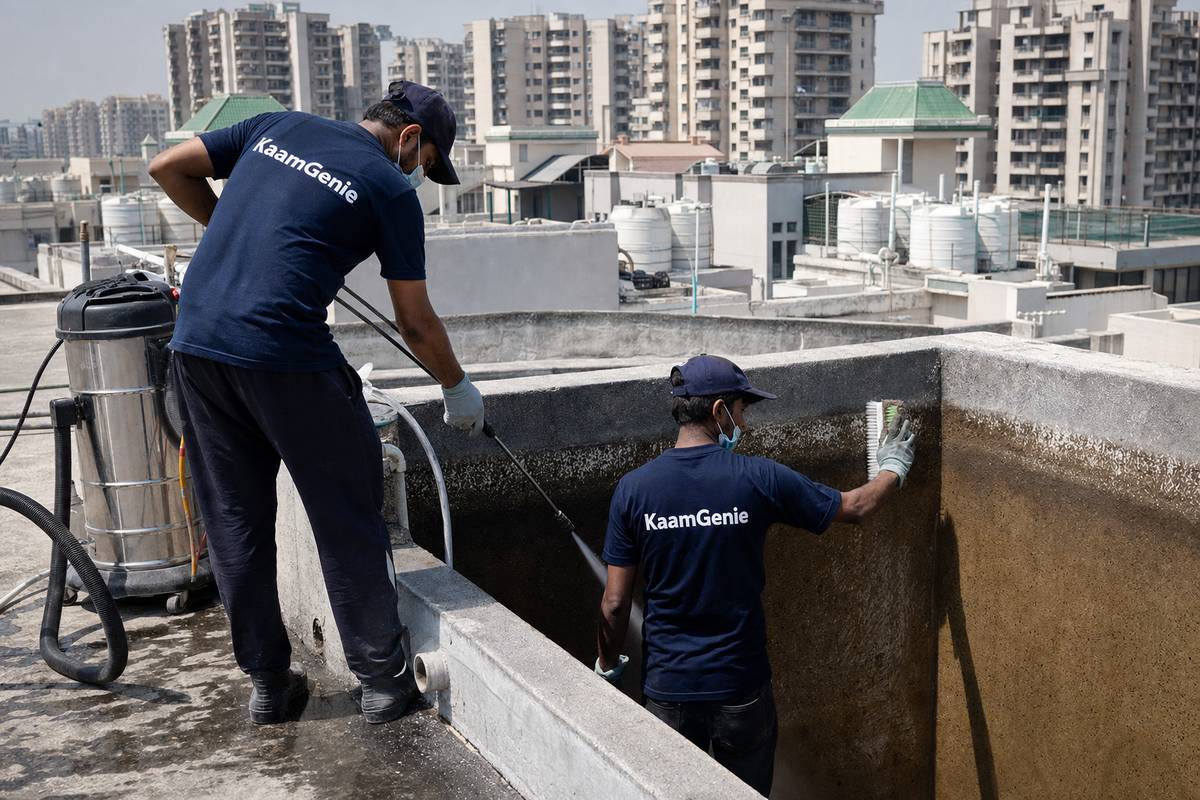 KaamGenie crew cleaning a overhead (rooftop) tank in Dwarka Sector 7, Delhi