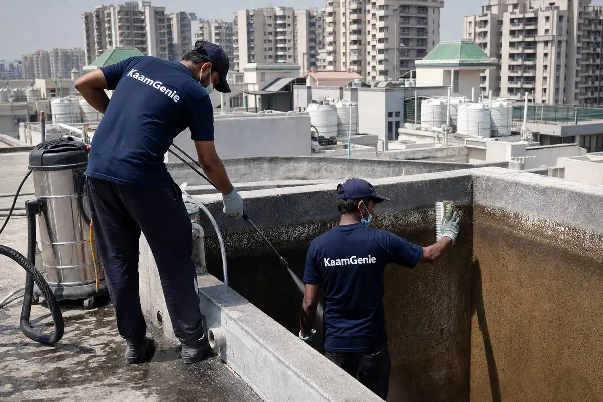 KaamGenie crew cleaning a overhead (rooftop) tank in Dwarka Sector 7, Delhi