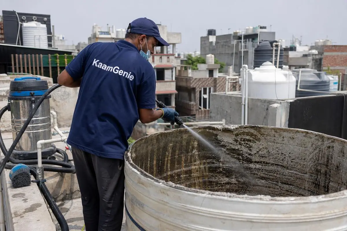 KaamGenie crew cleaning a overhead (rooftop) tank in Fateh Nagar, Delhi