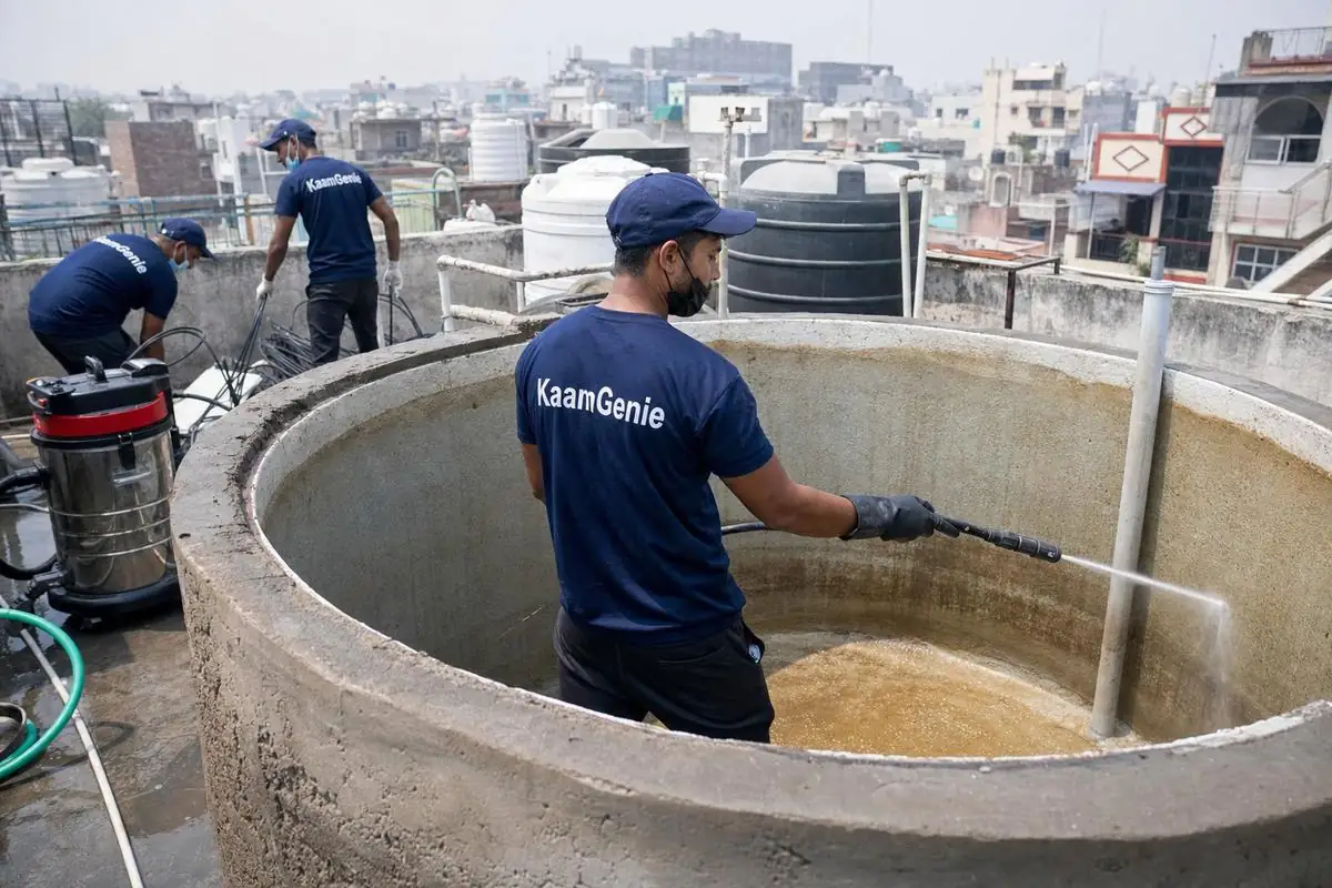 KaamGenie crew cleaning a overhead (rooftop) tank in Gautam Nagar, Delhi