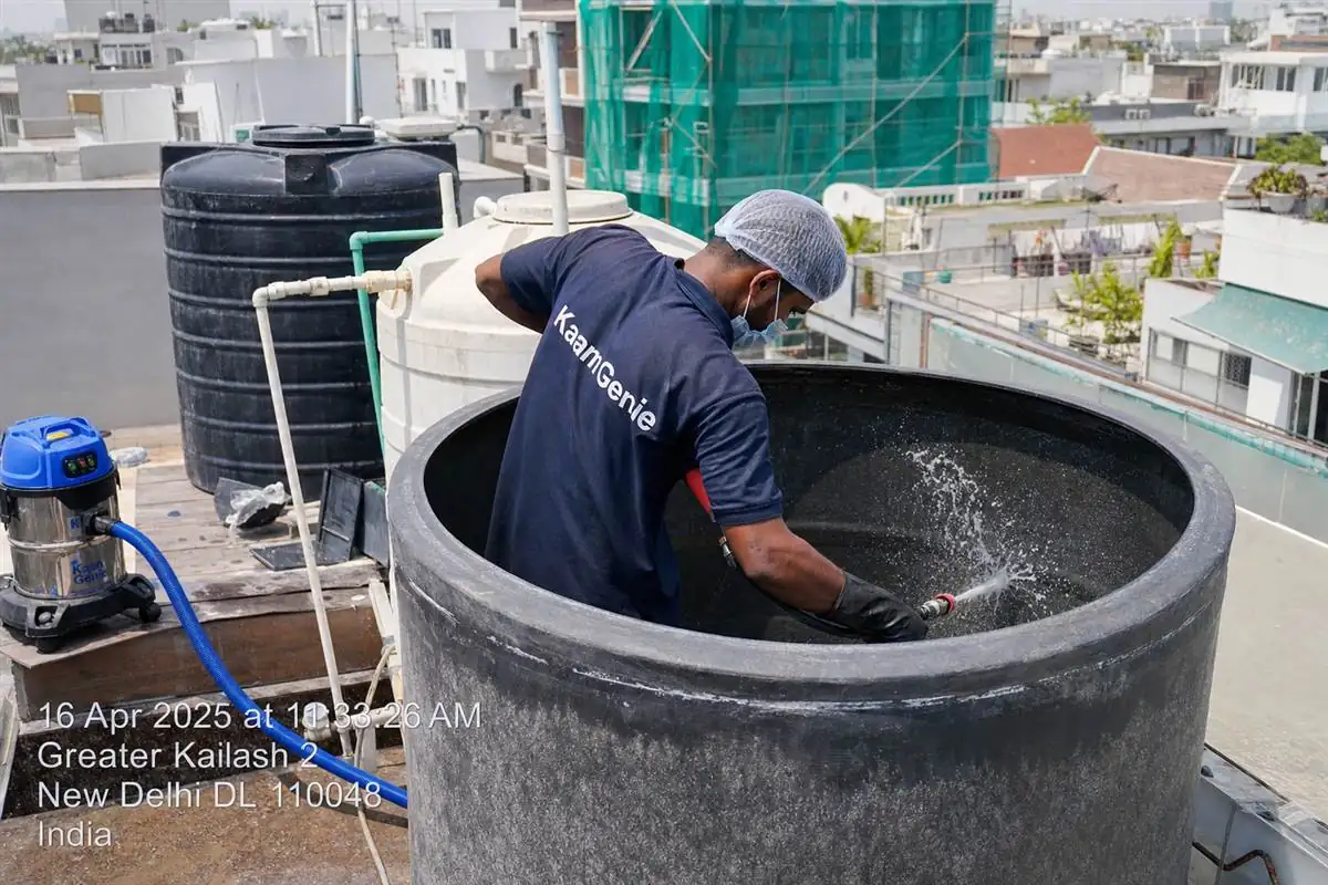 KaamGenie crew cleaning a overhead (rooftop) tank in Greater Kailash, Delhi