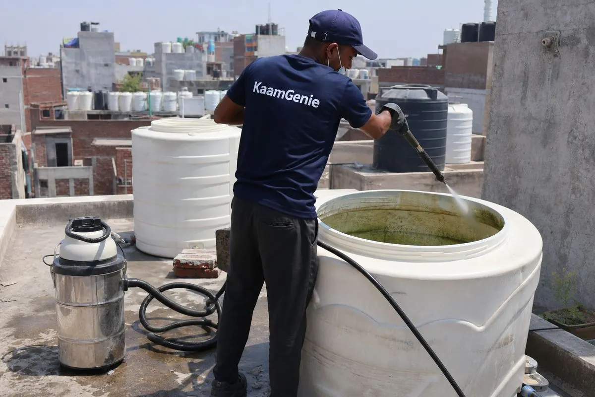 KaamGenie crew cleaning a overhead (rooftop) tank in Ibrahimpur, Delhi