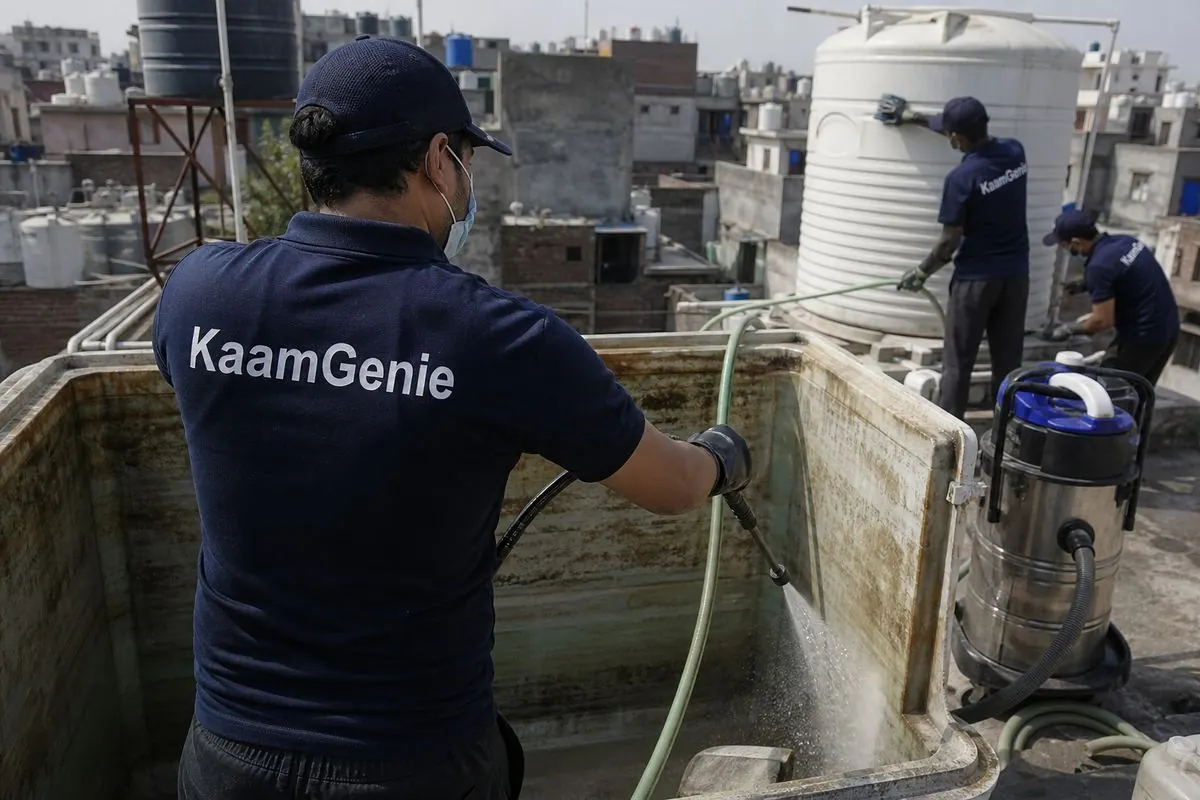 KaamGenie crew cleaning a overhead (rooftop) tank in Kalyanpuri, Delhi