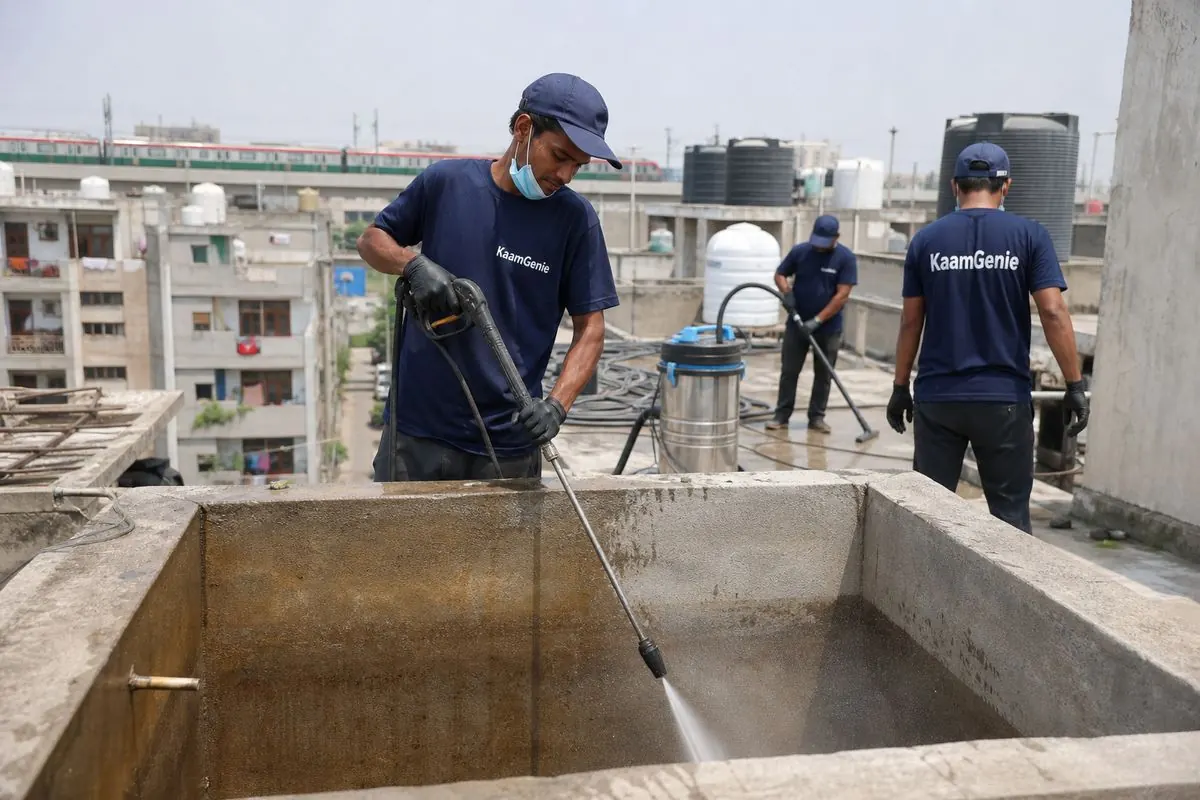 KaamGenie crew cleaning a overhead (rooftop) tank in Keshavpuram, Delhi