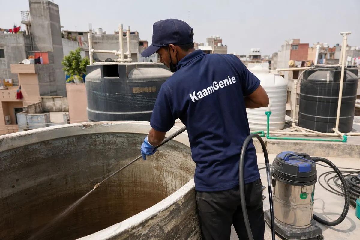 KaamGenie crew cleaning a overhead (rooftop) tank in Mahabir Nagar, Delhi