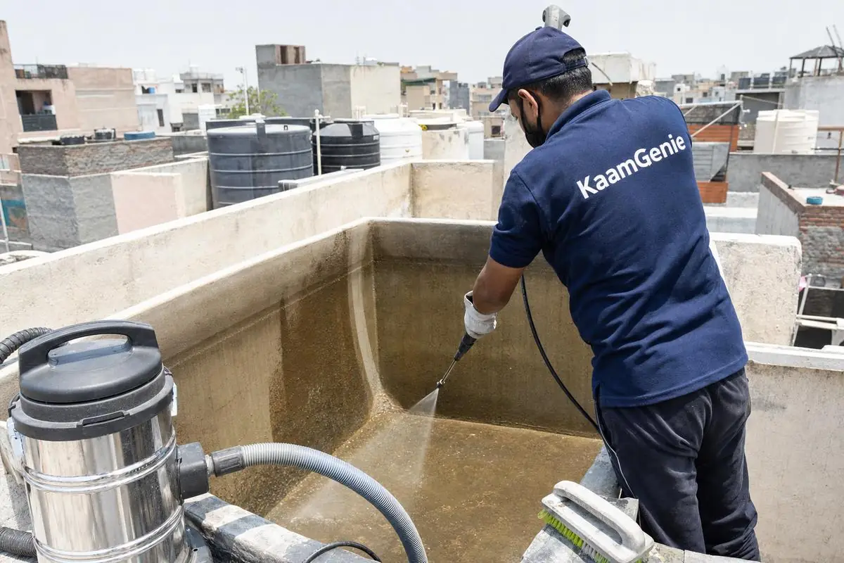 KaamGenie crew cleaning a overhead (rooftop) tank in Masudpur, Delhi