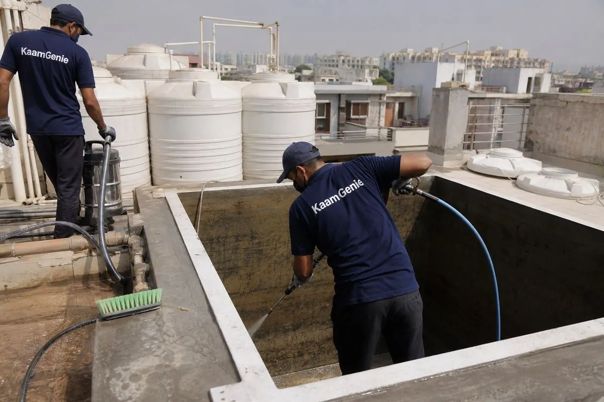 KaamGenie crew cleaning a overhead (rooftop) tank in Maurya Enclave, Delhi