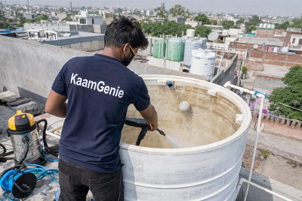 KaamGenie crew cleaning a overhead (rooftop) tank in Mehrauli, Delhi