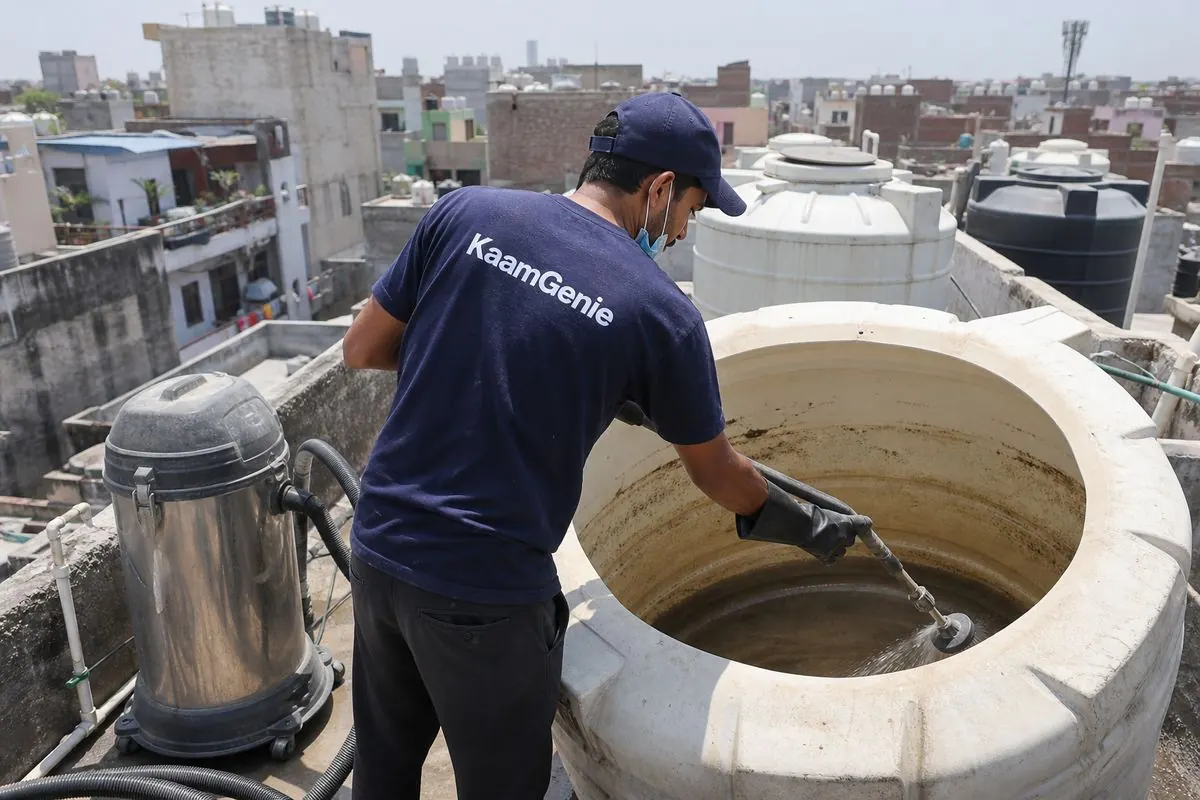 KaamGenie crew cleaning a overhead (rooftop) tank in Mohan Garden, Delhi
