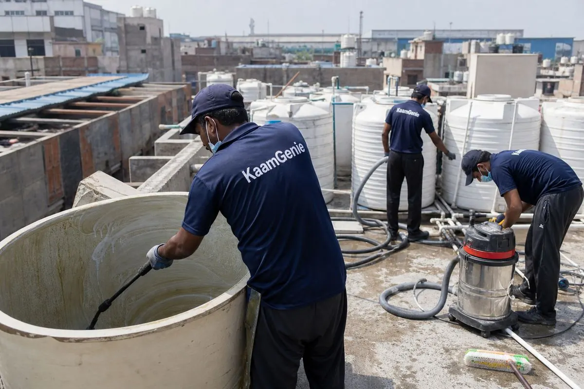 KaamGenie crew cleaning a overhead (rooftop) tank in Mundka, Delhi