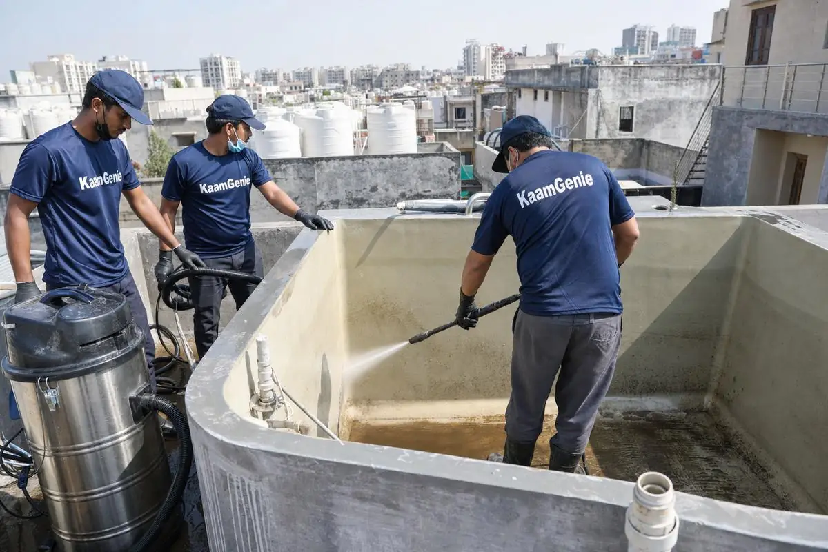 KaamGenie crew cleaning a overhead (rooftop) tank in Neb Sarai, Delhi