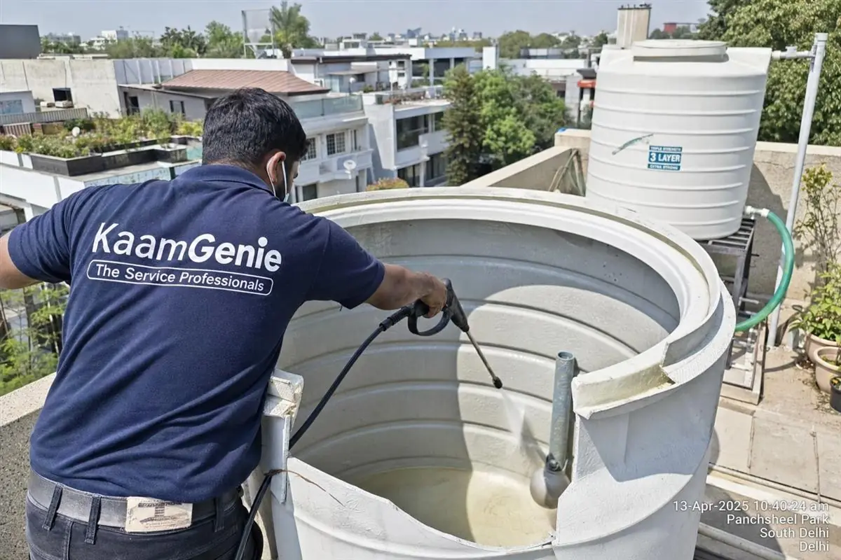 KaamGenie crew cleaning a overhead (rooftop) tank in Panchsheel Park, Delhi