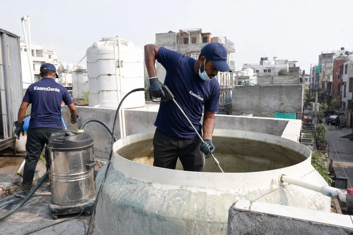 KaamGenie crew cleaning a overhead (rooftop) tank in Rajgarh Colony, Delhi