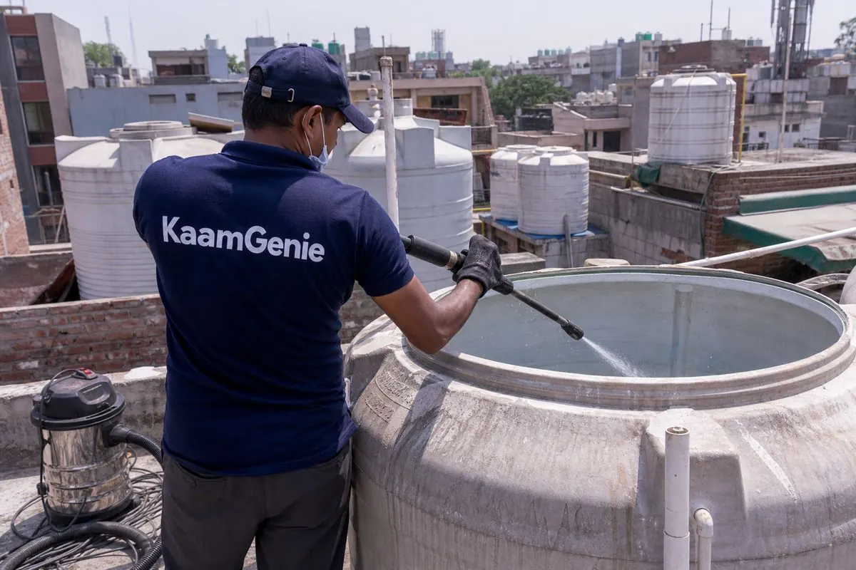 KaamGenie crew cleaning a overhead (rooftop) tank in Ramesh Nagar, Delhi