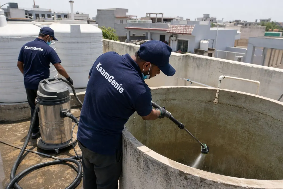 KaamGenie crew cleaning a overhead (rooftop) tank in Ramprastha (Delhi side), Delhi