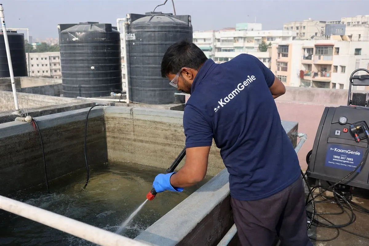 KaamGenie crew cleaning a overhead (rooftop) tank in RK Puram, Delhi