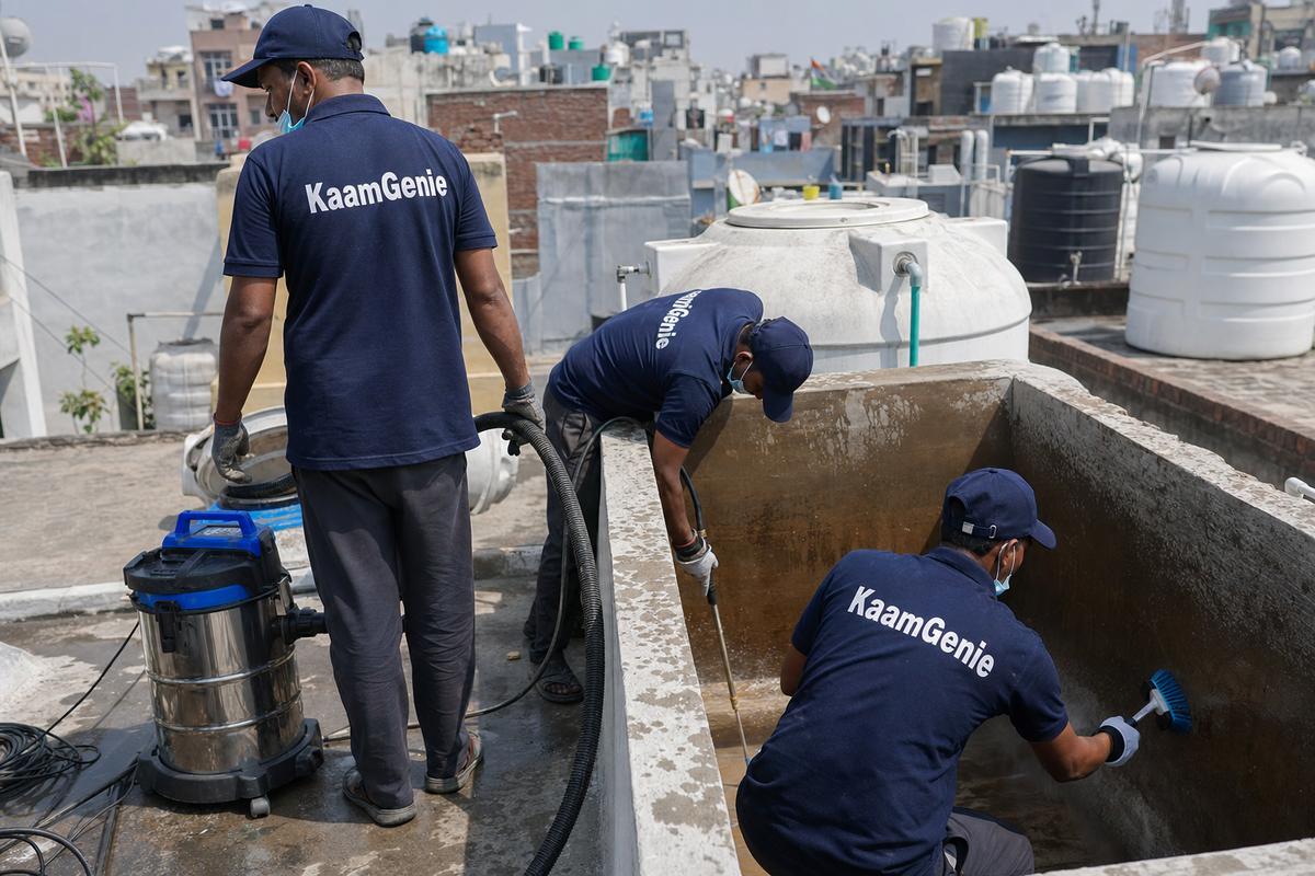 KaamGenie crew cleaning a overhead (rooftop) tank in Sagarpur, Delhi