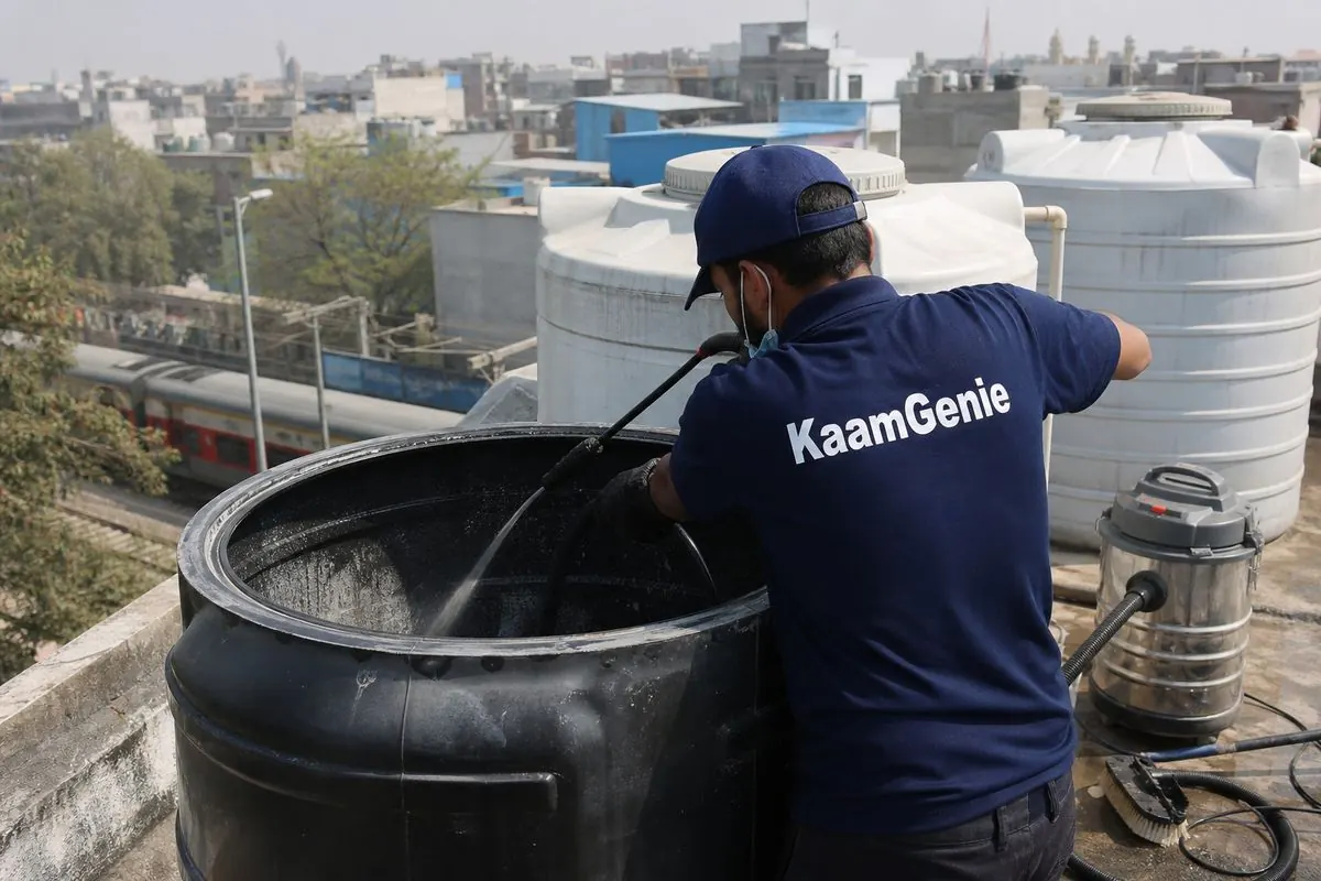 KaamGenie crew cleaning a overhead (rooftop) tank in Sarai Rohilla, Delhi