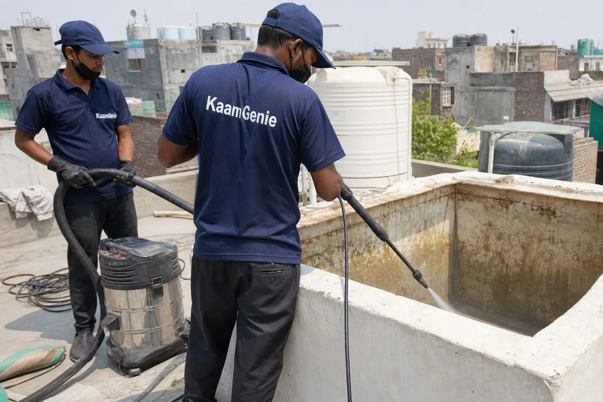 KaamGenie crew cleaning a overhead (rooftop) tank in Shastri Nagar (North West), Delhi