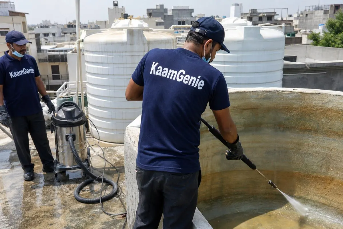KaamGenie crew cleaning a overhead (rooftop) tank in Subhash Nagar, Delhi