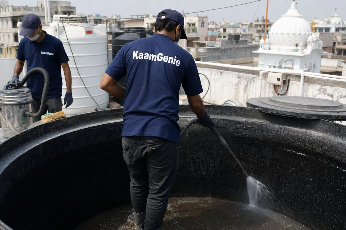 KaamGenie crew cleaning a overhead (rooftop) tank in Tilak Nagar, Delhi