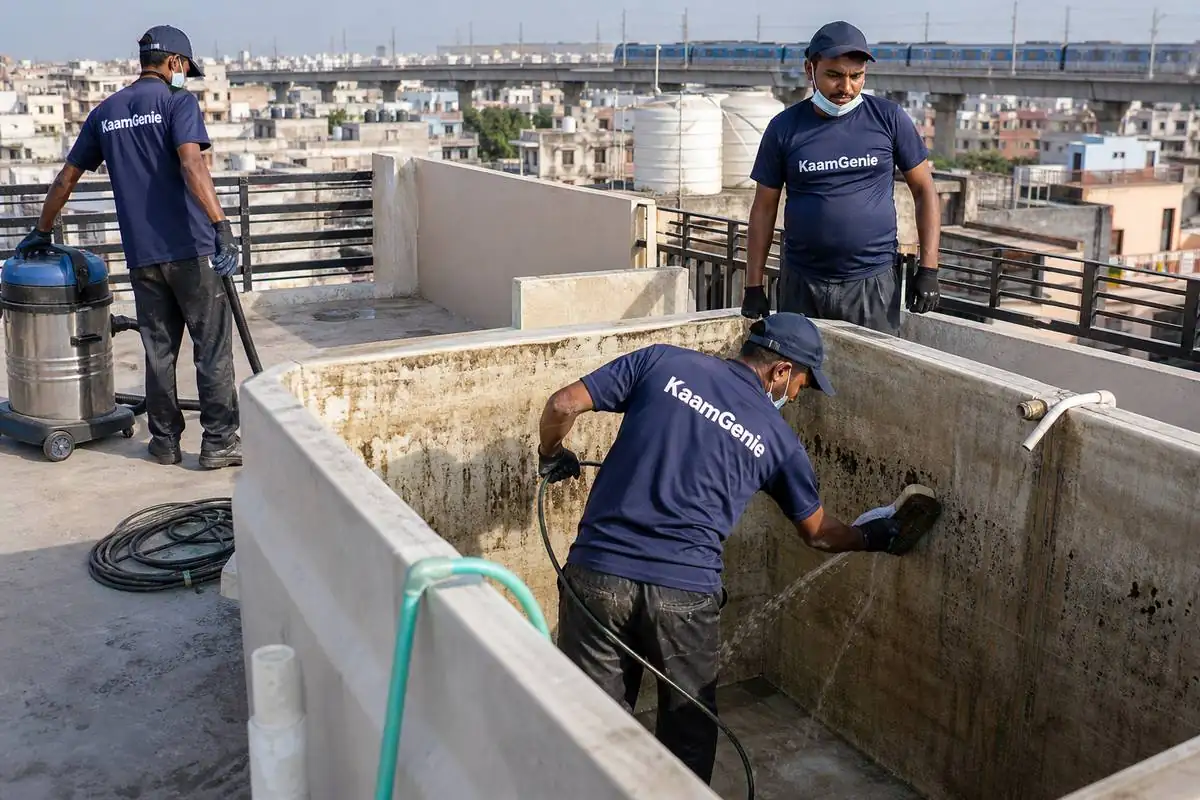 KaamGenie crew cleaning a overhead (rooftop) tank in Uttam Nagar, Delhi