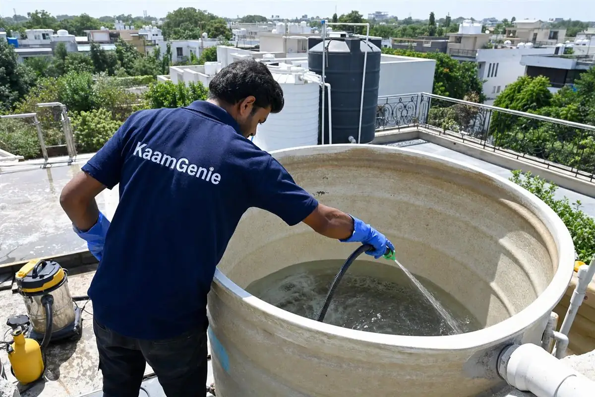 KaamGenie crew cleaning a overhead (rooftop) tank in Vasant Vihar, Delhi