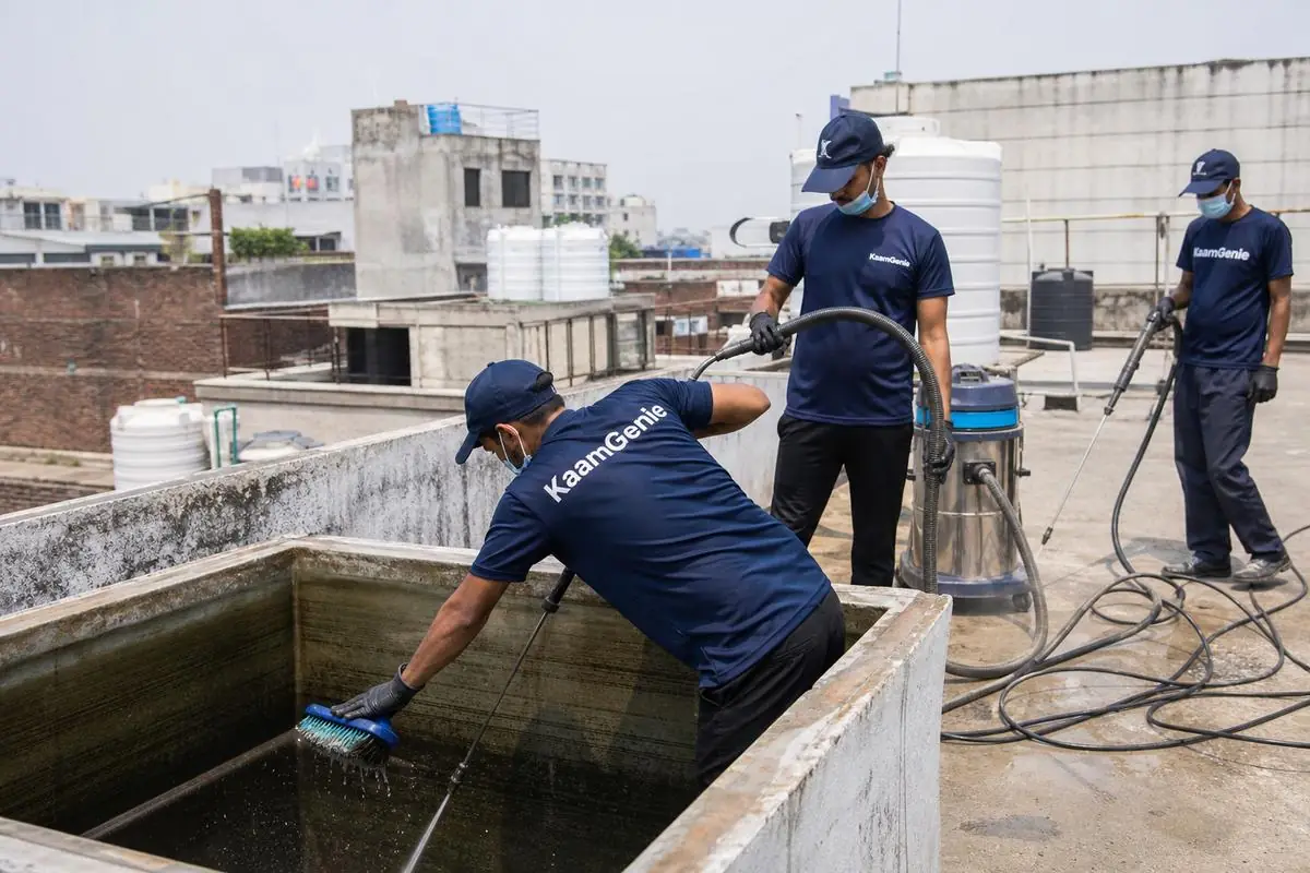 KaamGenie crew cleaning a overhead (rooftop) tank in Vishnu Garden, Delhi