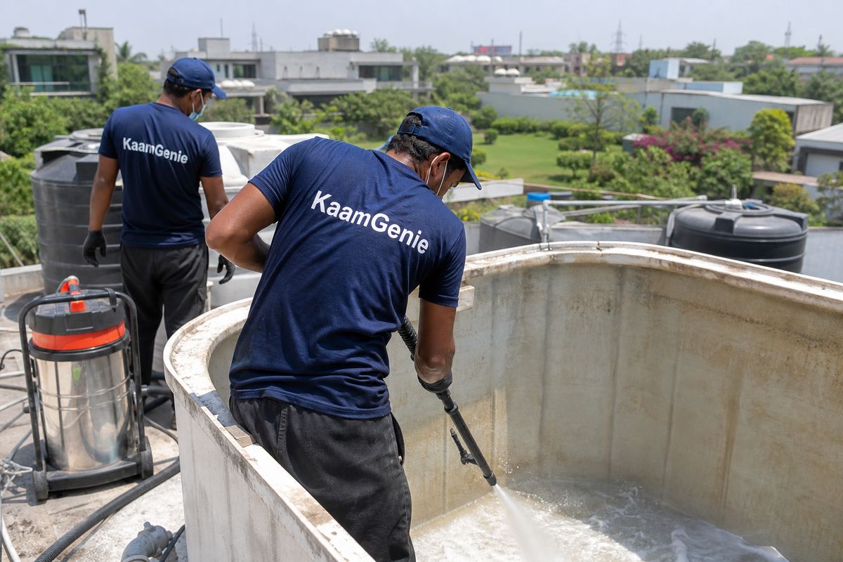 KaamGenie crew cleaning a overhead (rooftop) tank in Westend Greens & DLF Farms, Delhi