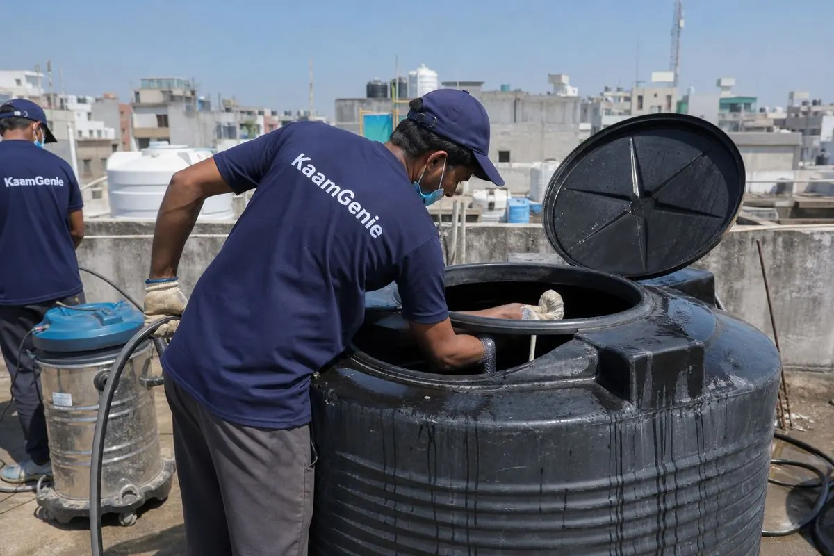 KaamGenie crew cleaning a Sintex / plastic tank in Adarsh Nagar, Delhi
