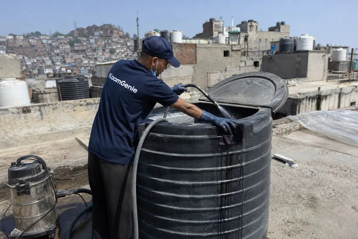 KaamGenie crew cleaning a Sintex / plastic tank in Anand Parbat, Delhi