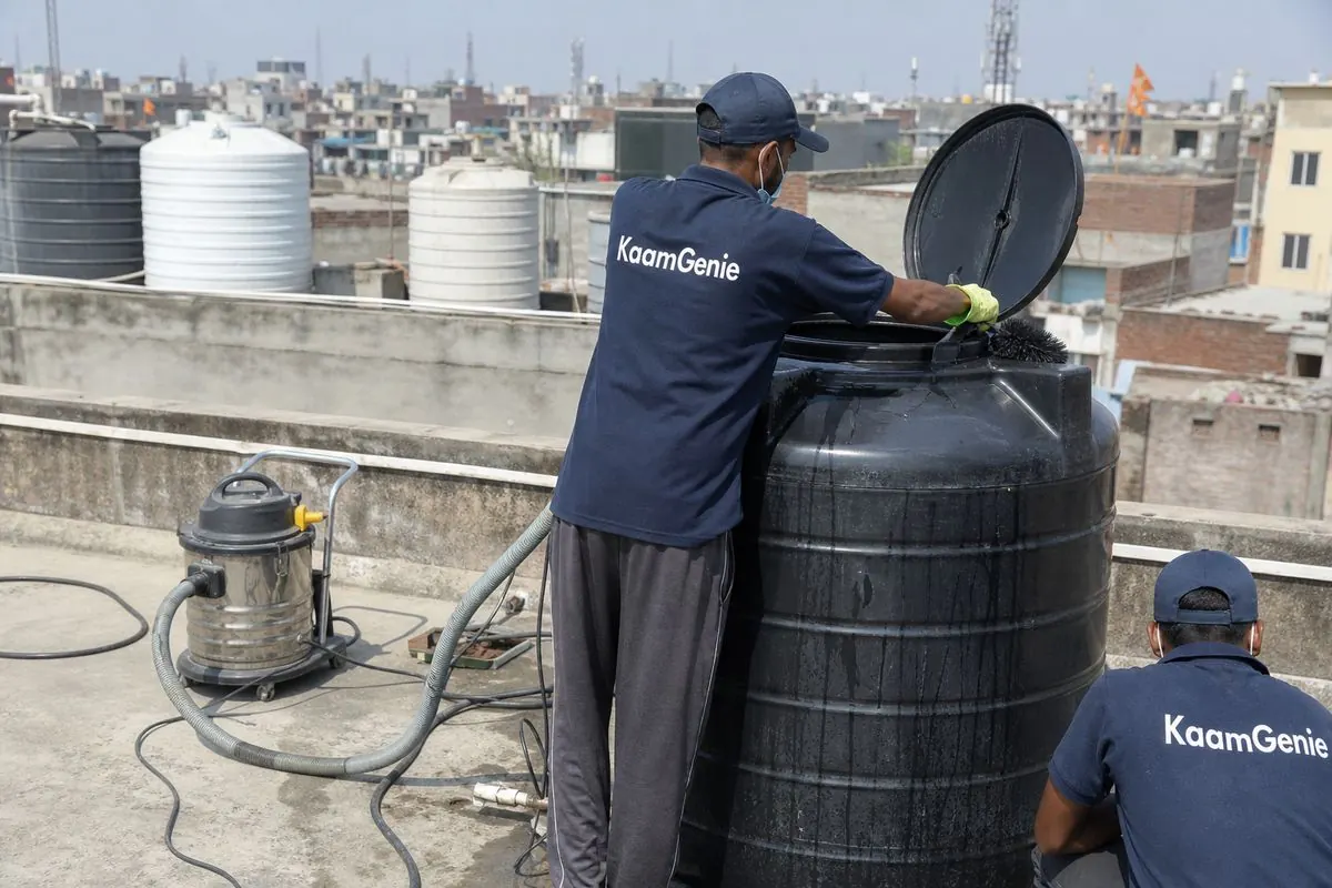 KaamGenie crew cleaning a Sintex / plastic tank in Babarpur, Delhi