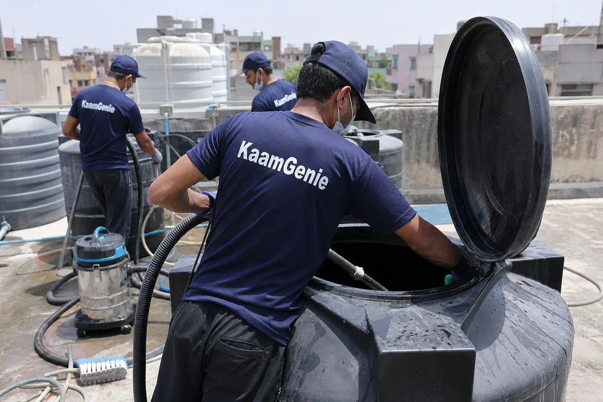 KaamGenie crew cleaning a Sintex / plastic tank in Dilshad Garden, Delhi
